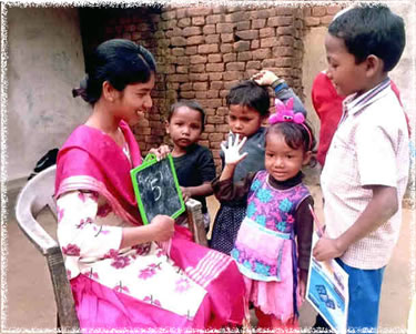 Pushpa Punita Marandi while tutoring village kids
